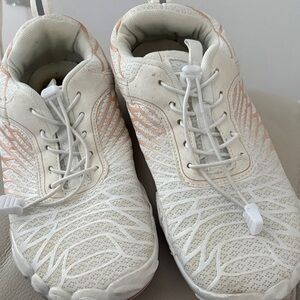 White and Pink Athletic Shoes